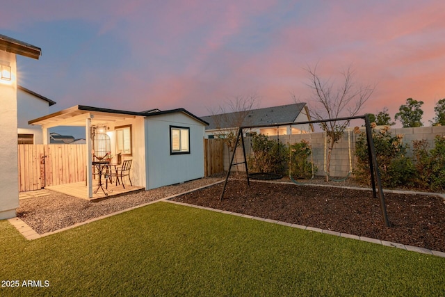 exterior space featuring an outbuilding and a fenced backyard