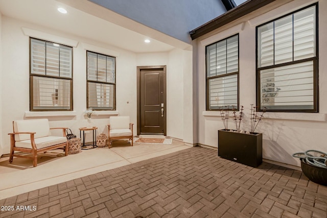 entrance to property featuring a patio