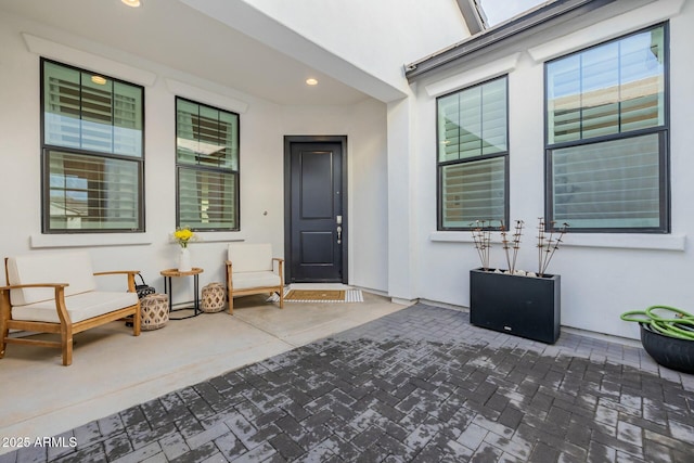 entrance to property with a patio