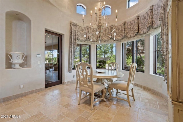 dining area featuring a notable chandelier