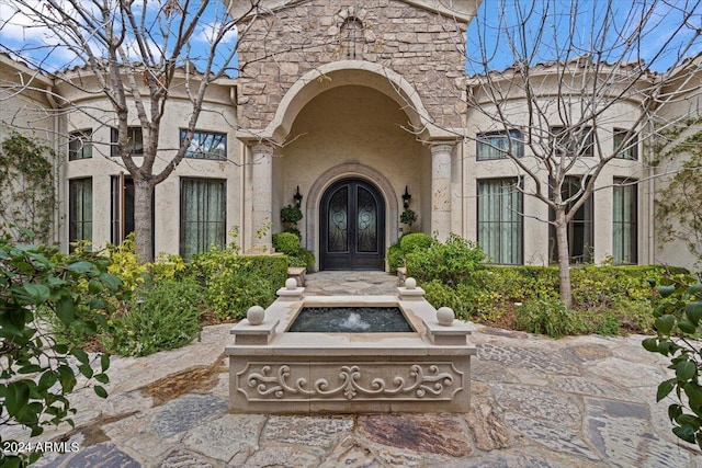 entrance to property featuring french doors