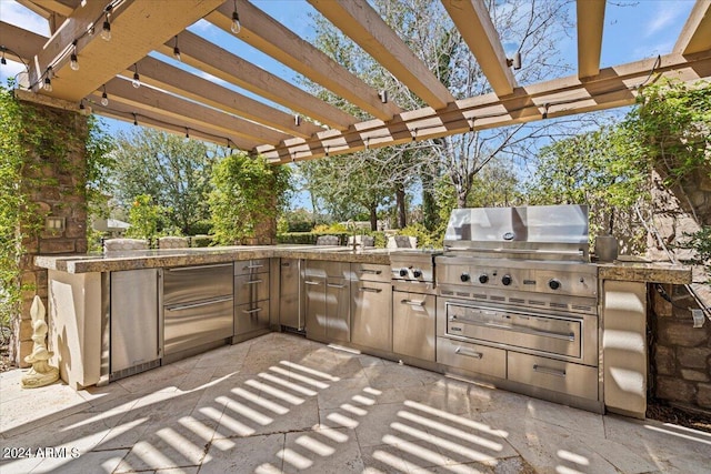 view of patio featuring a pergola, grilling area, and exterior kitchen