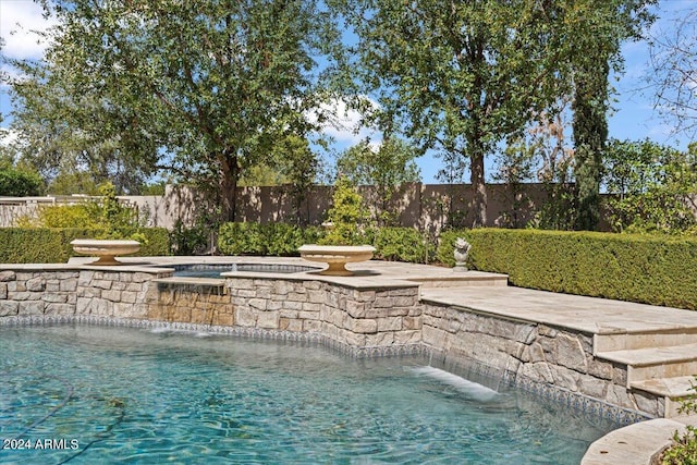 view of swimming pool featuring pool water feature