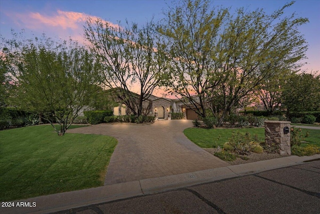 view of front of property with a yard