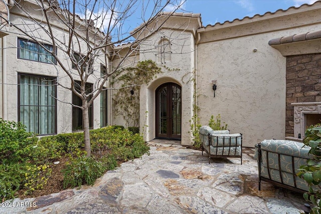 doorway to property with a patio