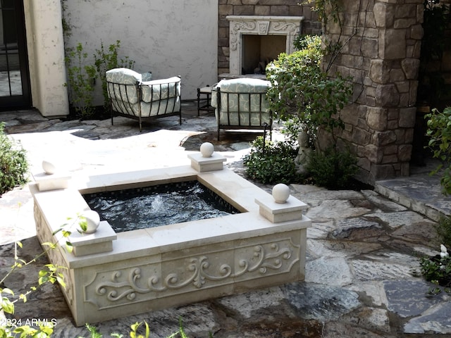 view of patio / terrace with an outdoor fire pit