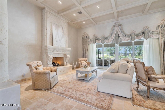 living room featuring beam ceiling, coffered ceiling, a high end fireplace, a towering ceiling, and ornamental molding