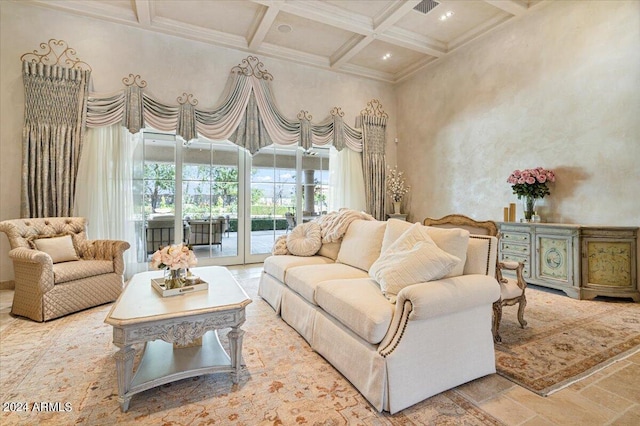 living room with beam ceiling, a high ceiling, coffered ceiling, and ornamental molding