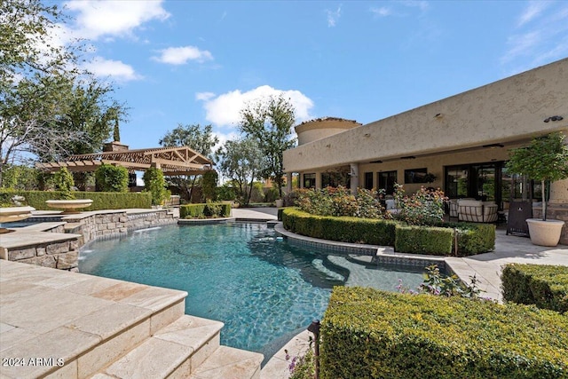 view of pool featuring pool water feature and a patio