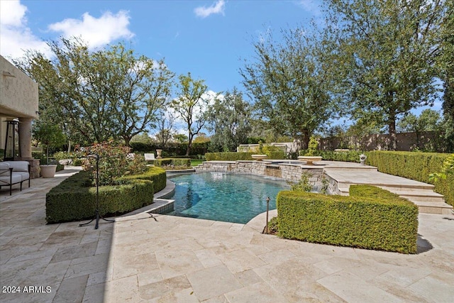 view of pool featuring an in ground hot tub and a patio