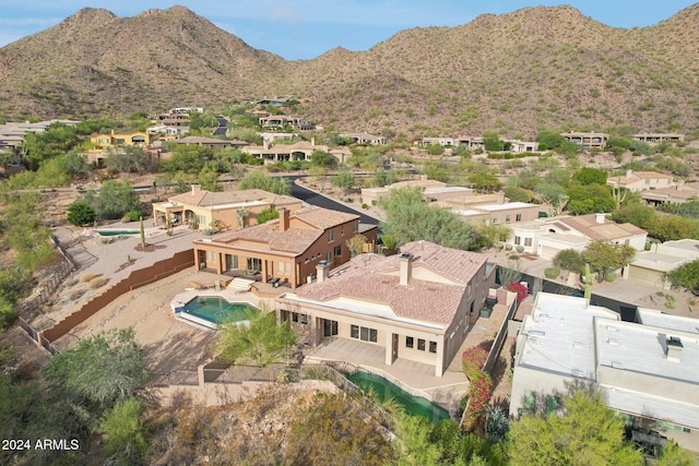 birds eye view of property featuring a mountain view