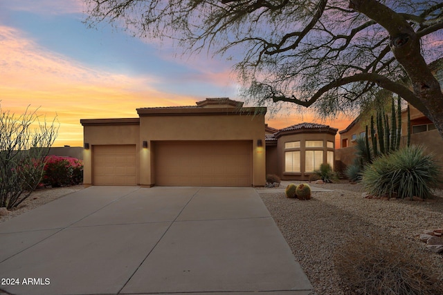 view of front of property with a garage