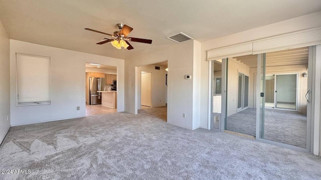 carpeted empty room with ceiling fan