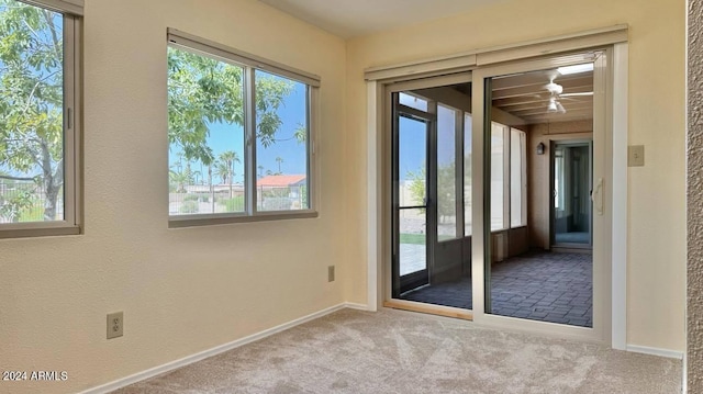 doorway featuring light colored carpet