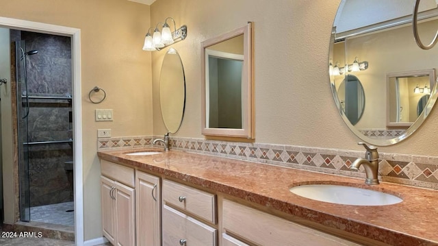 bathroom featuring walk in shower and vanity