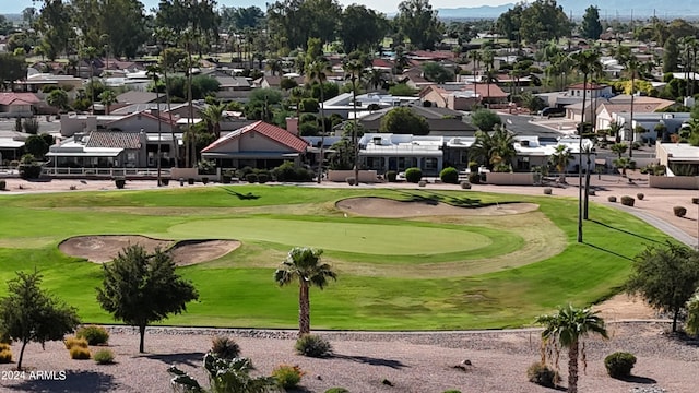 view of property's community with a lawn