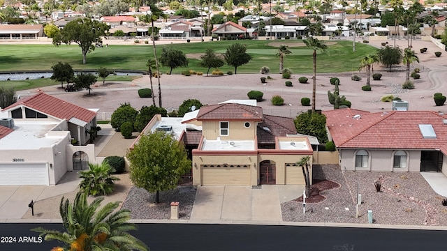 bird's eye view with view of golf course and a residential view