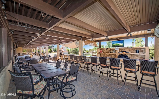 view of patio / terrace featuring an outdoor bar