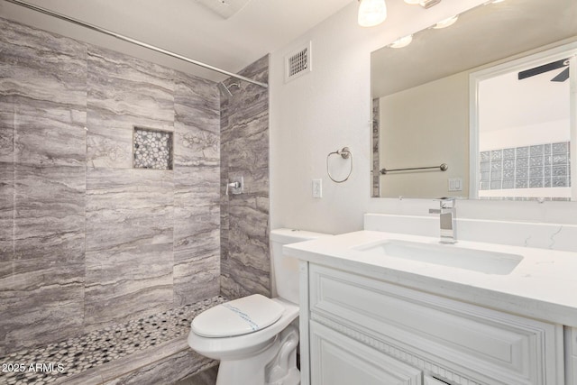 4901 S Calle Los Cerros Dr Unit 220, Tempe, AZ 85282 - bathroom featuring toilet, vanity, and a tile shower