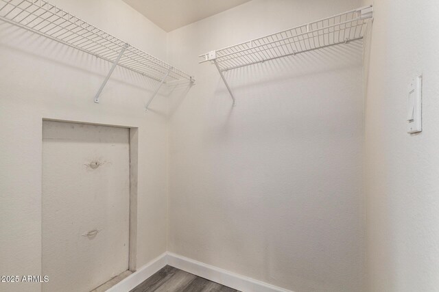 4901 S Calle Los Cerros Dr Unit 220, Tempe, AZ 85282 - walk in closet featuring dark wood-type flooring