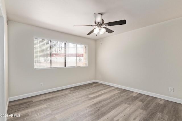 4901 S Calle Los Cerros Dr Unit 220, Tempe, AZ 85282 - unfurnished room featuring wood finished floors, a ceiling fan, and baseboards