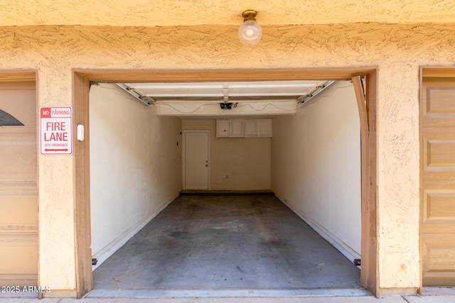 4901 S Calle Los Cerros Dr Unit 220, Tempe, AZ 85282 - garage featuring a garage door opener
