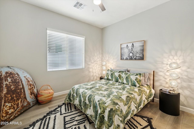 bedroom featuring hardwood / wood-style flooring and ceiling fan