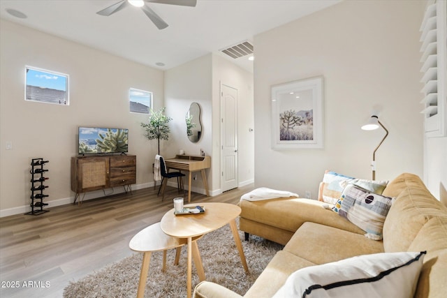 living room with hardwood / wood-style floors and ceiling fan