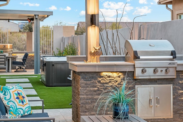 view of patio / terrace with exterior kitchen and area for grilling