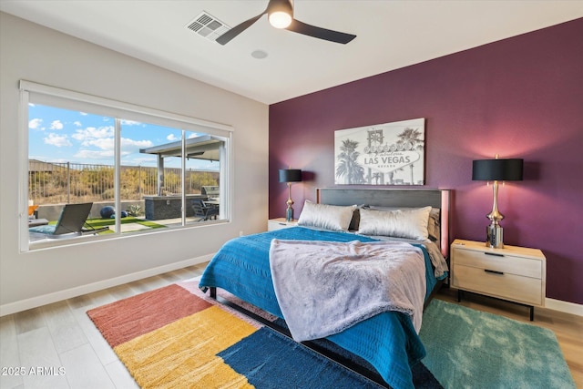 bedroom with hardwood / wood-style floors and ceiling fan