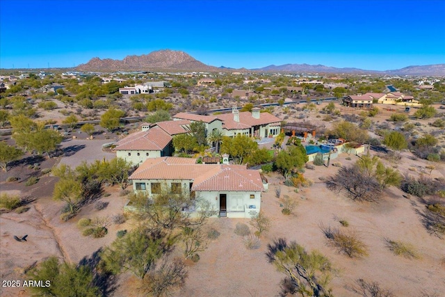 birds eye view of property with a mountain view