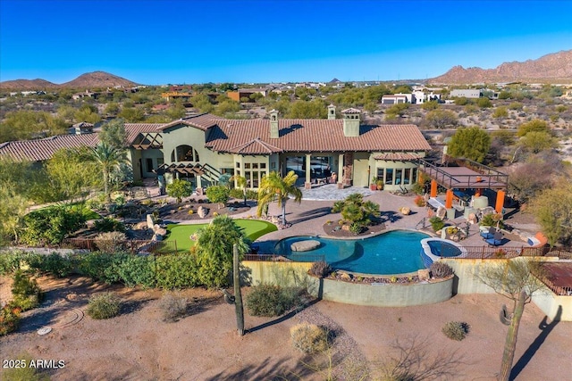 exterior space with a mountain view and a patio