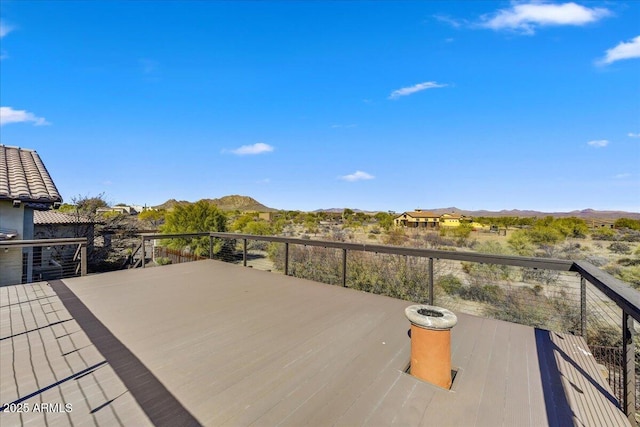 wooden terrace featuring a mountain view