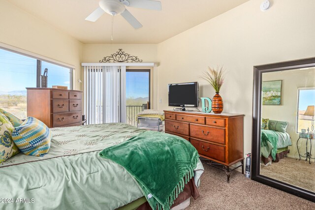 carpeted bedroom with access to exterior, multiple windows, and ceiling fan