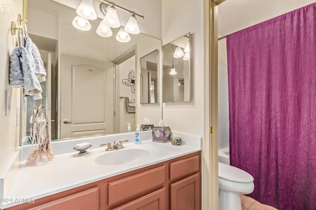 full bathroom featuring vanity, toilet, and shower / bath combo with shower curtain