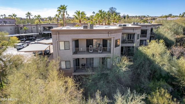 rear view of house featuring a balcony