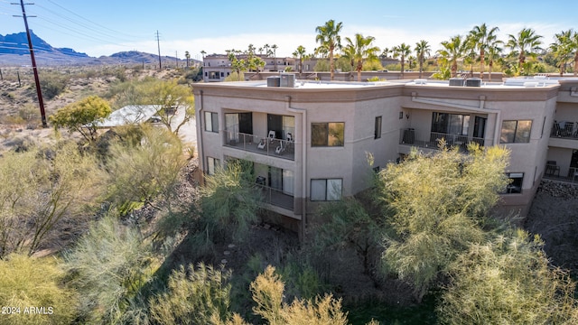 exterior space featuring a mountain view and a balcony