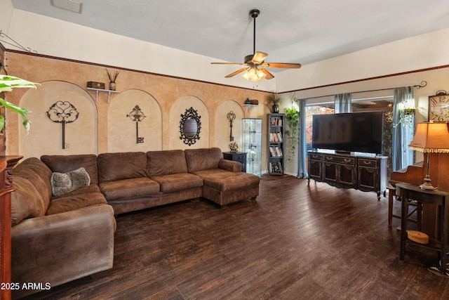 living area with visible vents, ceiling fan, and wood finished floors