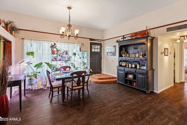 dining space featuring an inviting chandelier, baseboards, visible vents, and dark wood-style flooring