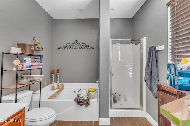 full bathroom with vanity, plus walk in shower, wood-type flooring, and toilet