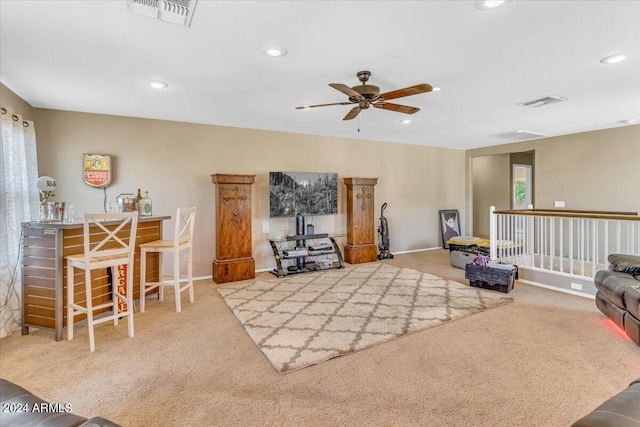 living room with carpet and ceiling fan