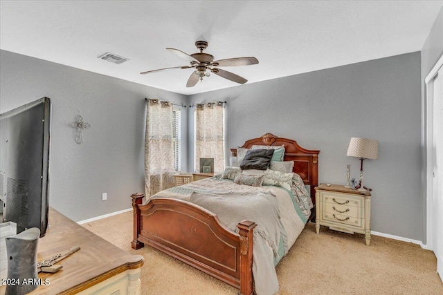 carpeted bedroom with ceiling fan