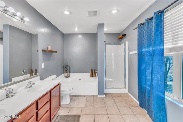 full bathroom featuring toilet, shower with separate bathtub, vanity, and tile patterned floors