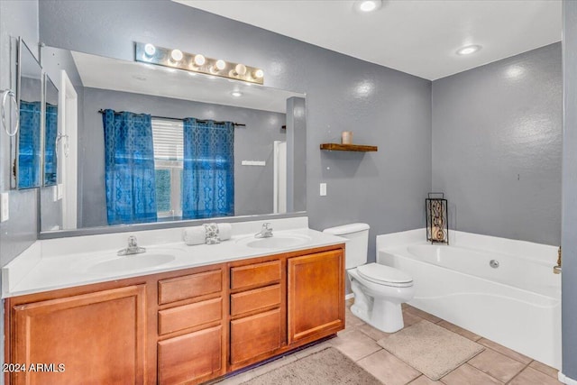 bathroom featuring a tub to relax in, tile patterned flooring, vanity, and toilet