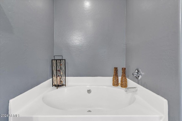 bathroom with a washtub