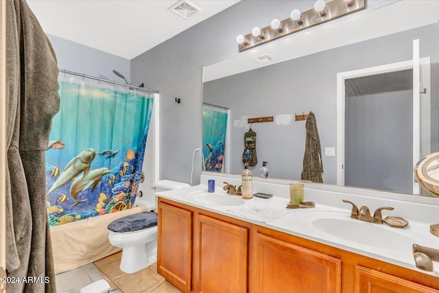 full bathroom featuring tile patterned flooring, vanity, shower / tub combo, and toilet