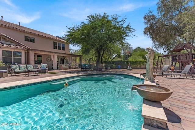 view of swimming pool featuring an outdoor living space, a playground, pool water feature, and a patio area