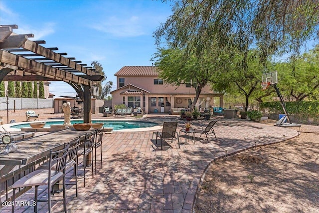 view of swimming pool featuring a pergola and a patio