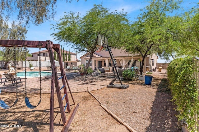 view of playground with a pergola and a fenced in pool