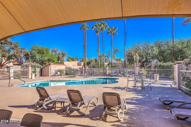 view of swimming pool with a patio